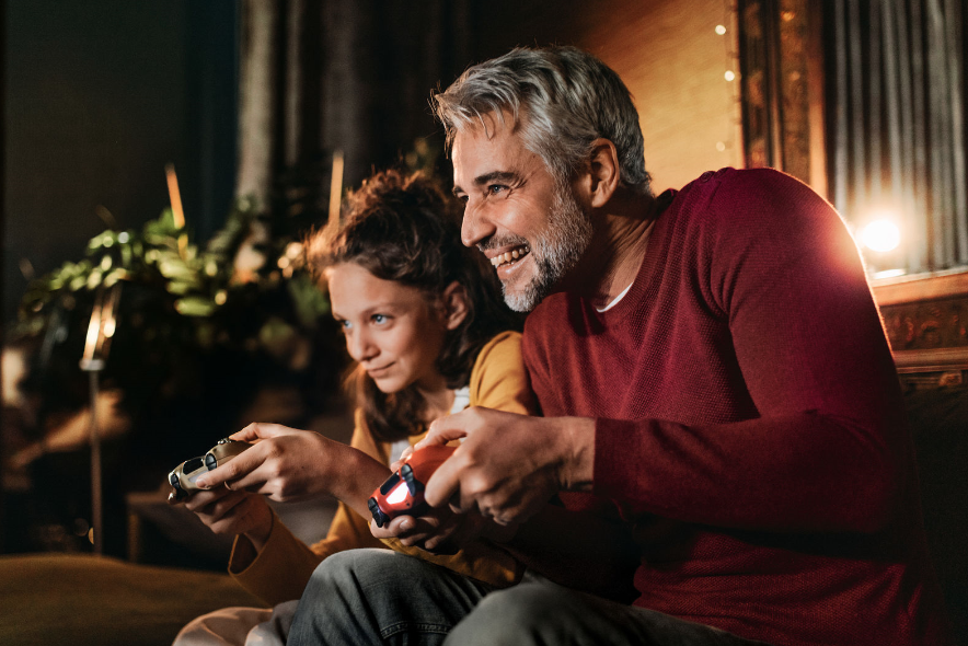 Dad and Daughter playing video game