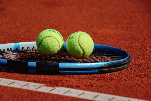 tennis ball on racket
